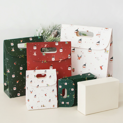 Gift bag assortment beside proposed plain unbranded ivory outer packaging